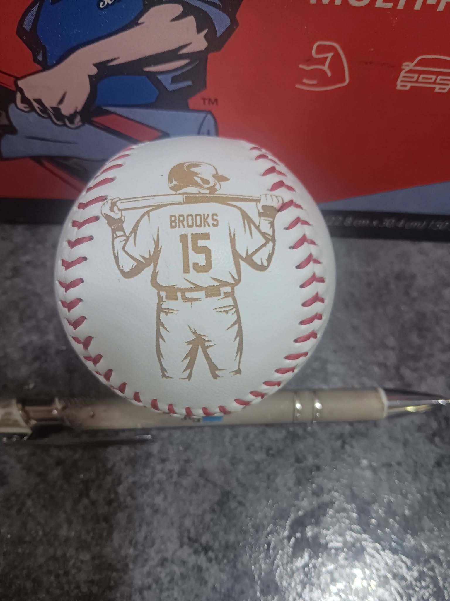 Custom laser engraved leather baseball with player name and number