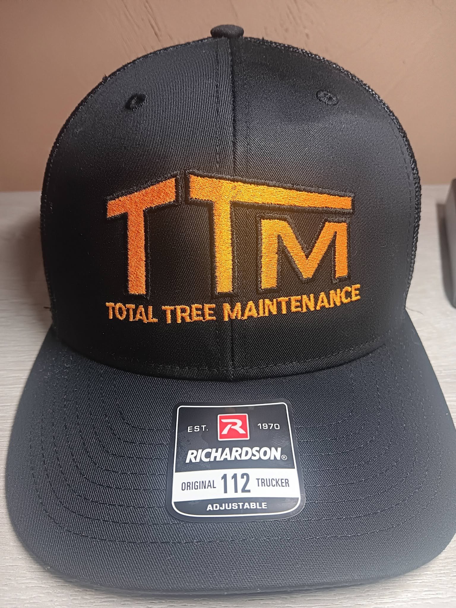 Custom embroidered trucker hat for Total Tree Maintenance